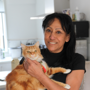 A Puhinui Park resident holding an orange cat